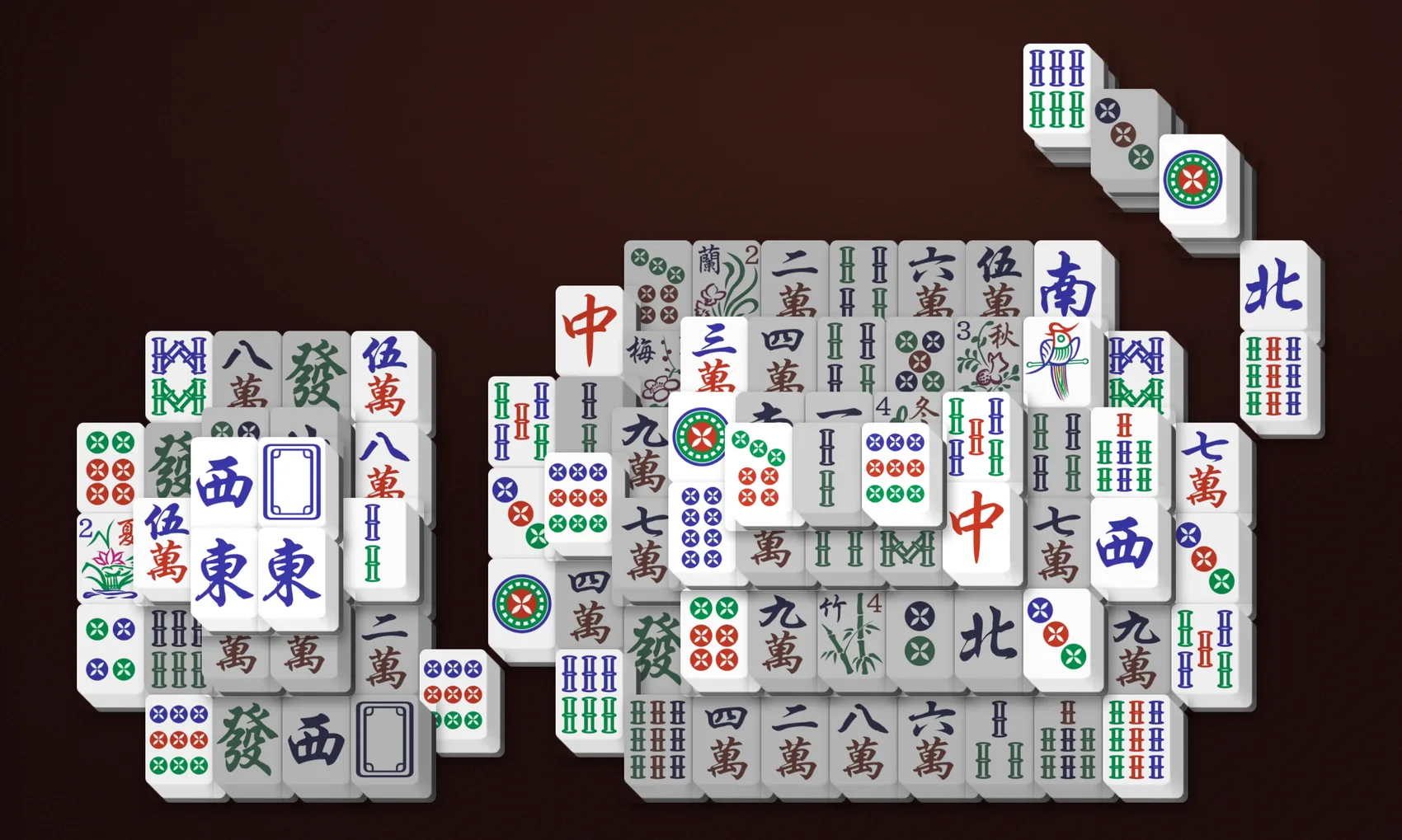The Cat Mahjong Solitaire layout seen from above, a sitting cat shape with two pointed ears, a broad body, and a tail curving up to one side